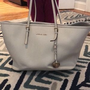 Michale Kors white tote with gold embellishments